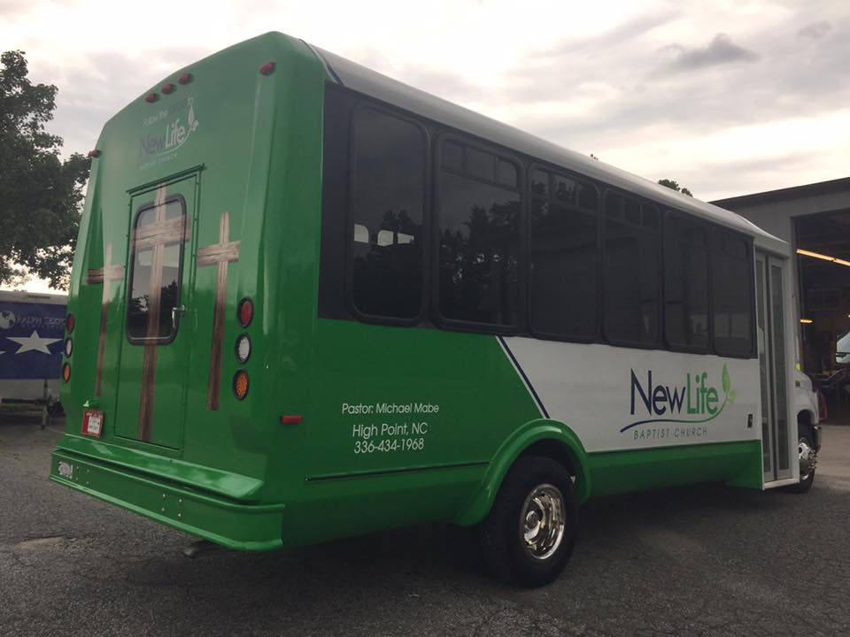Green painted and wrapped minibus