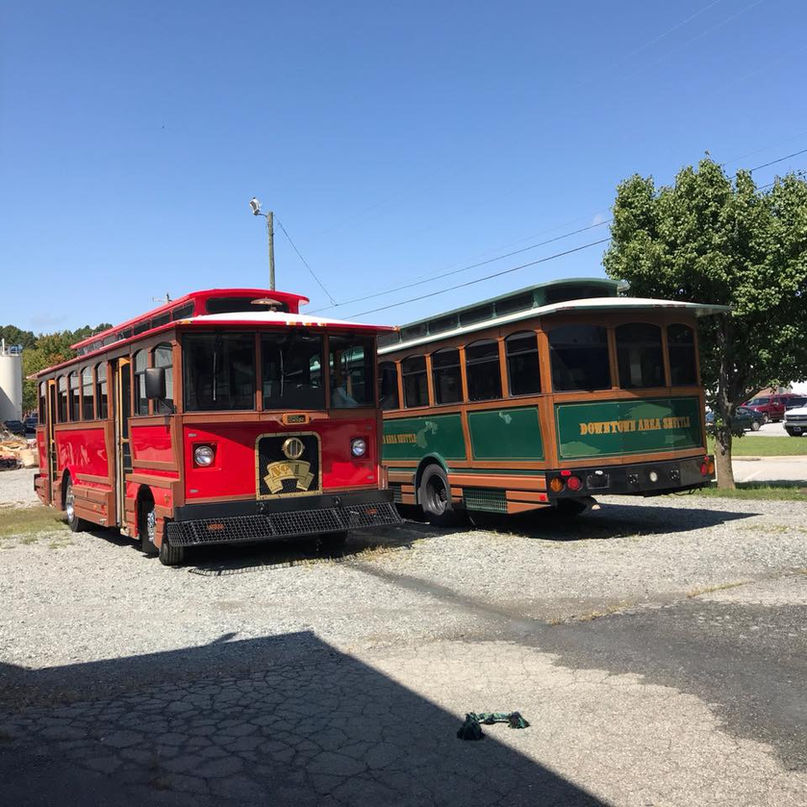 Two painted trolleys side by side